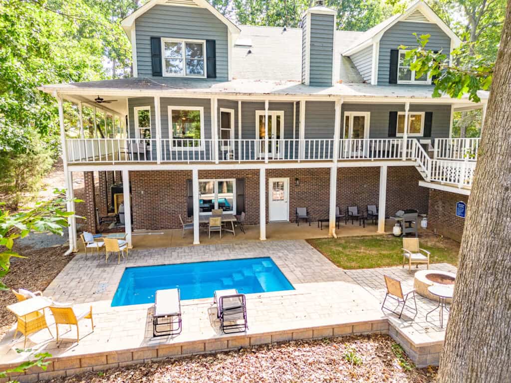 a house with a pool and patio