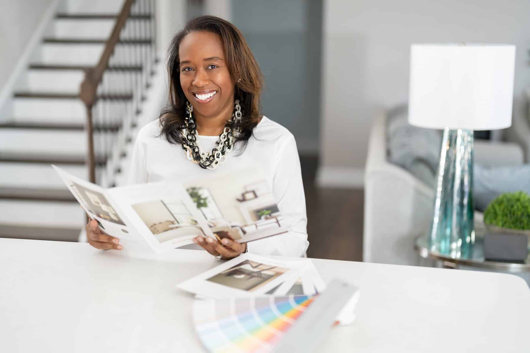 a woman holding a magazine