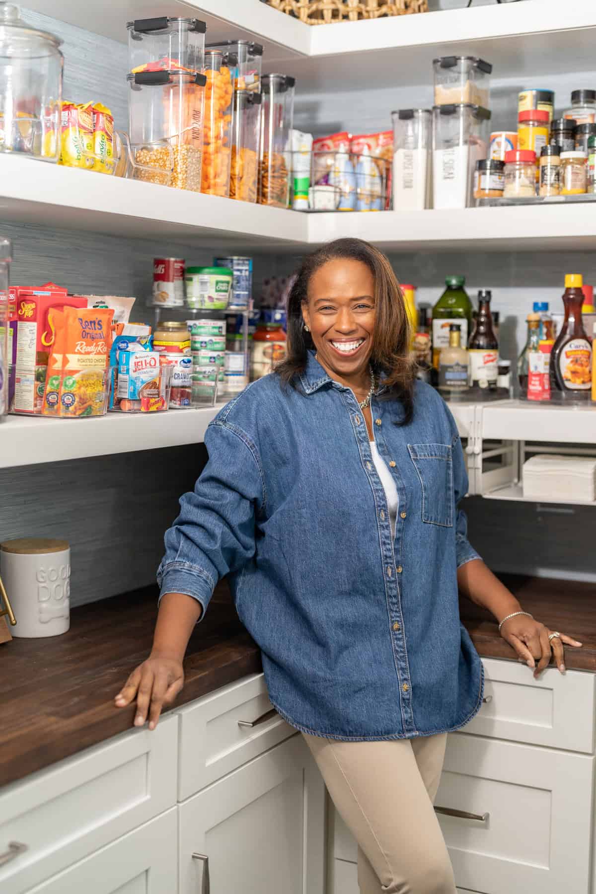 a woman standing in a pantry